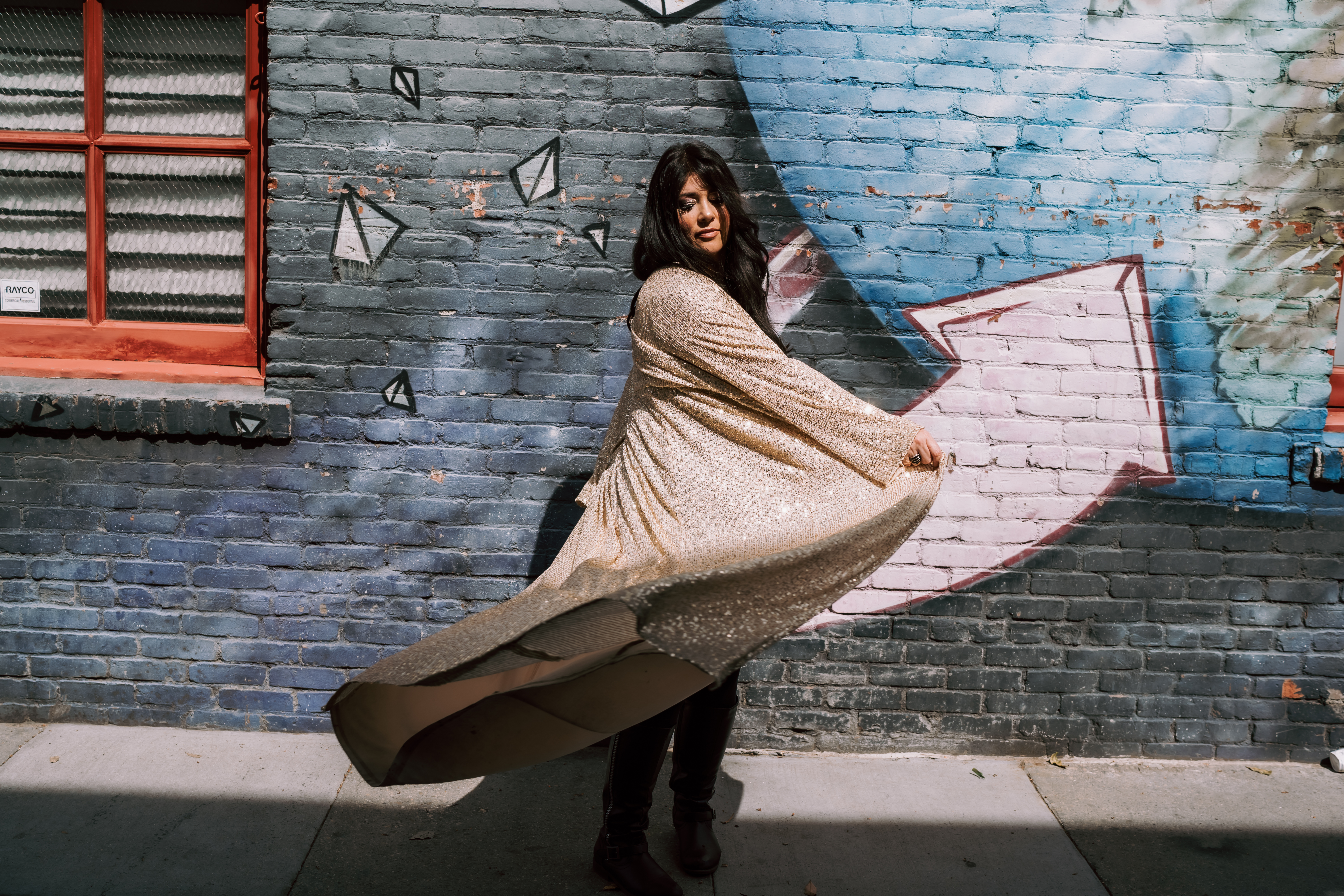 Abi Levine in a pink jacket, smiling